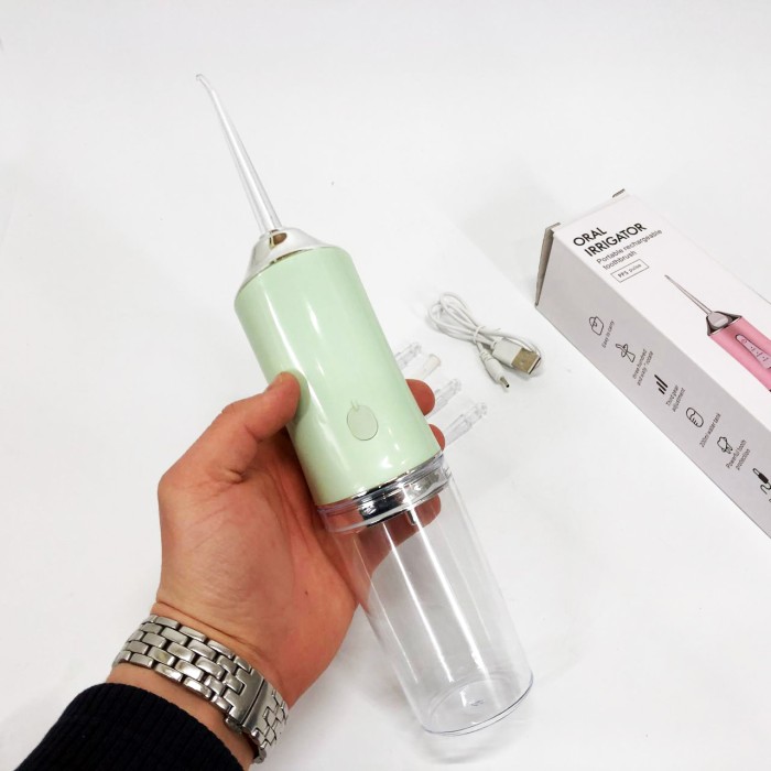 Іригатор для чищення зубів та порожнини рота Oral Irrigator з акумулятором та змінними насадками. Колір: зелений IC-20