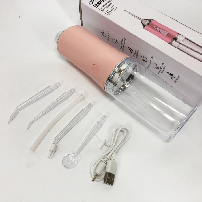Іригатор для чищення зубів та порожнини рота Oral Irrigator з акумулятором та змінними насадками. Колір: рожевий WP-96