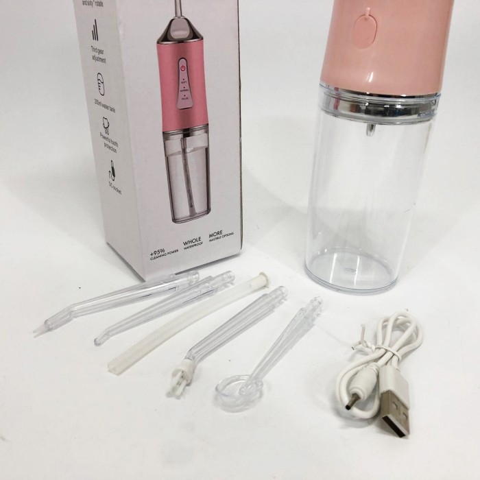 Іригатор для чищення зубів та порожнини рота Oral Irrigator з акумулятором та змінними насадками. Колір: рожевий WP-96