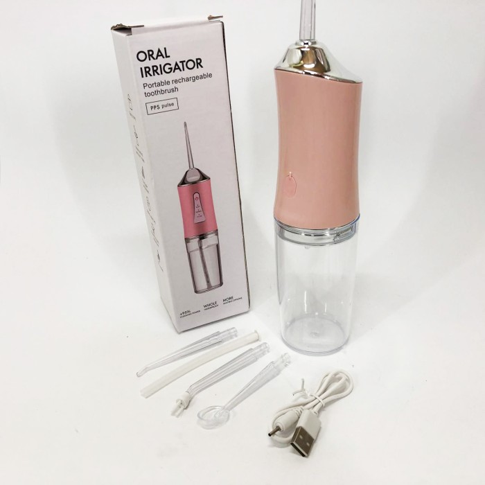 Іригатор для чищення зубів та порожнини рота Oral Irrigator з акумулятором та змінними насадками. Колір: рожевий WP-96