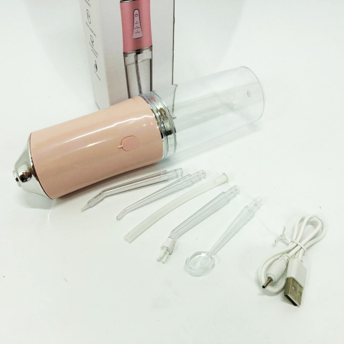 Іригатор для чищення зубів та порожнини рота Oral Irrigator з акумулятором та змінними насадками. Колір: рожевий ZQ-77