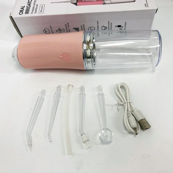 Іригатор для чищення зубів та порожнини рота Oral Irrigator з акумулятором та змінними насадками. Колір: рожевий ZQ-77