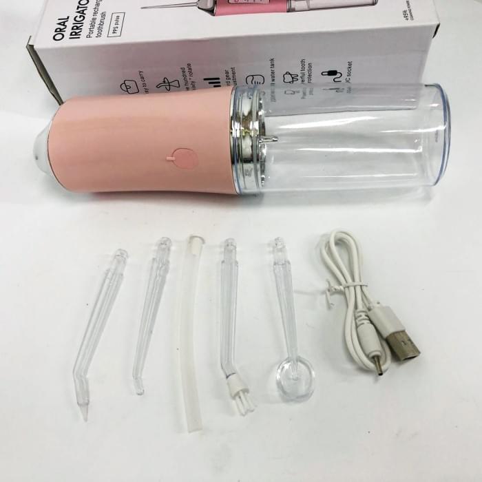Іригатор для чищення зубів та порожнини рота Oral Irrigator з акумулятором та змінними насадками. OS-286 Колір: рожевий