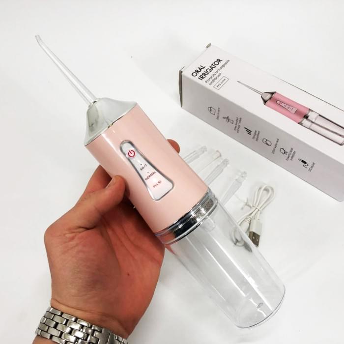 Іригатор для чищення зубів та порожнини рота Oral Irrigator з акумулятором та змінними насадками. OS-286 Колір: рожевий