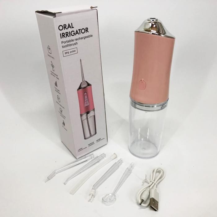 Іригатор для чищення зубів та порожнини рота Oral Irrigator з акумулятором та змінними насадками. OS-286 Колір: рожевий