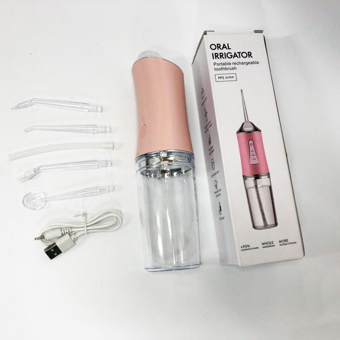 Іригатор для чищення зубів та порожнини рота Oral Irrigator з акумулятором та змінними насадками Pink